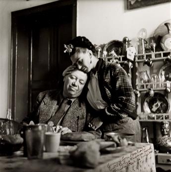 BRAVO, LOLA ALVAREZ (1907-1993) Frida with arm around bedpost, Casa Azul, Mexico.